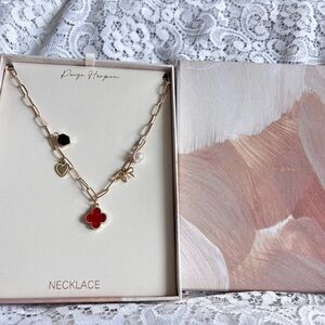 Gold Necklace with Red and Black Charms